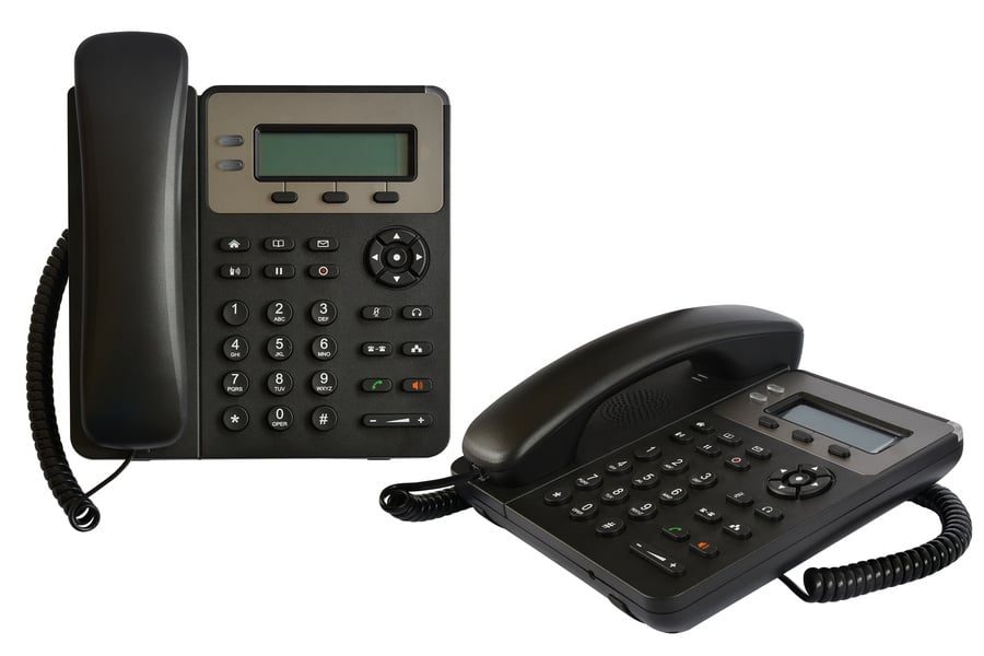 Telephone set with display and buttons. Modern phone for ip-telephony. Isolated, white background.